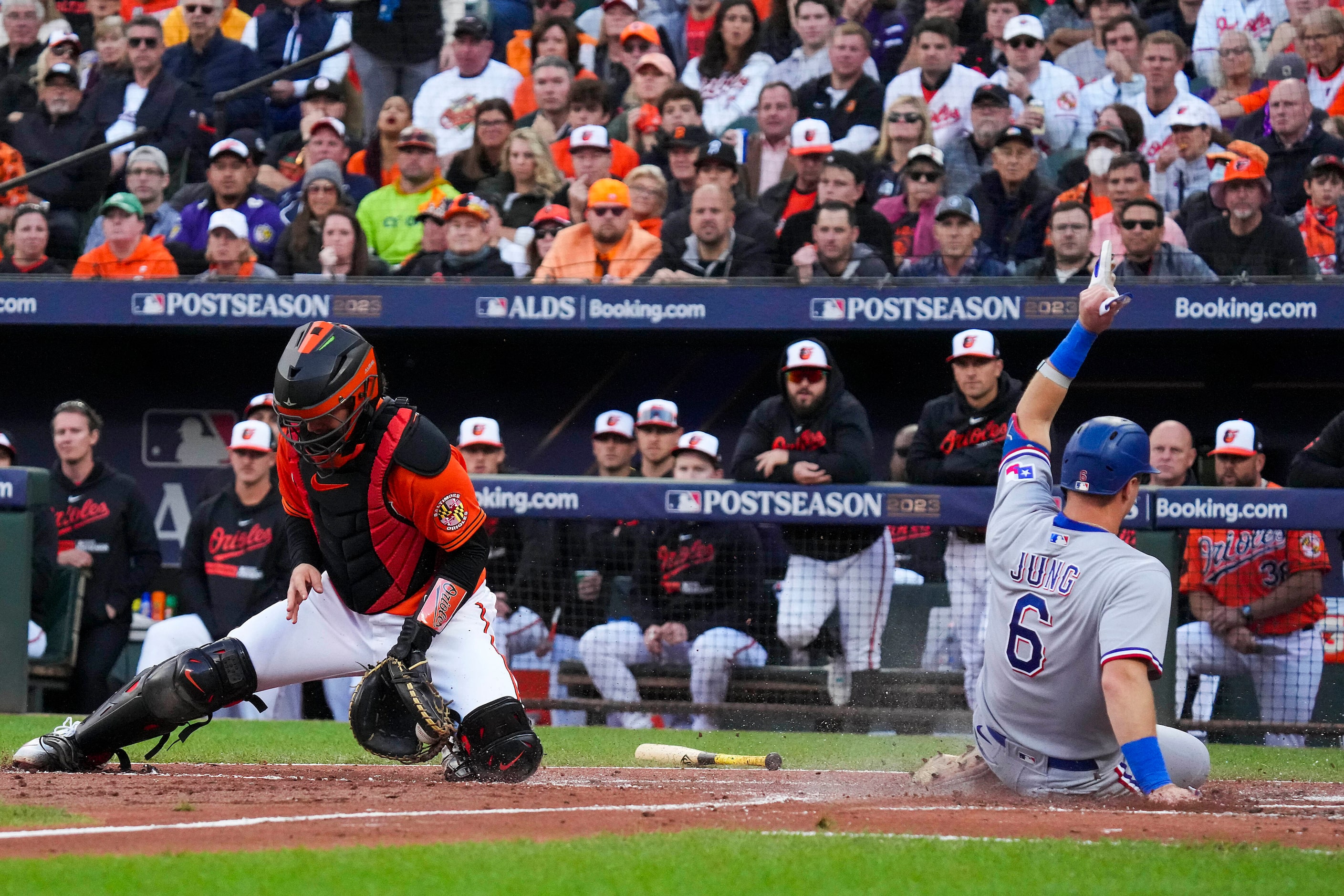 Texas Rangers third baseman Josh Jung (6) scores past Baltimore Orioles catcher Adley...