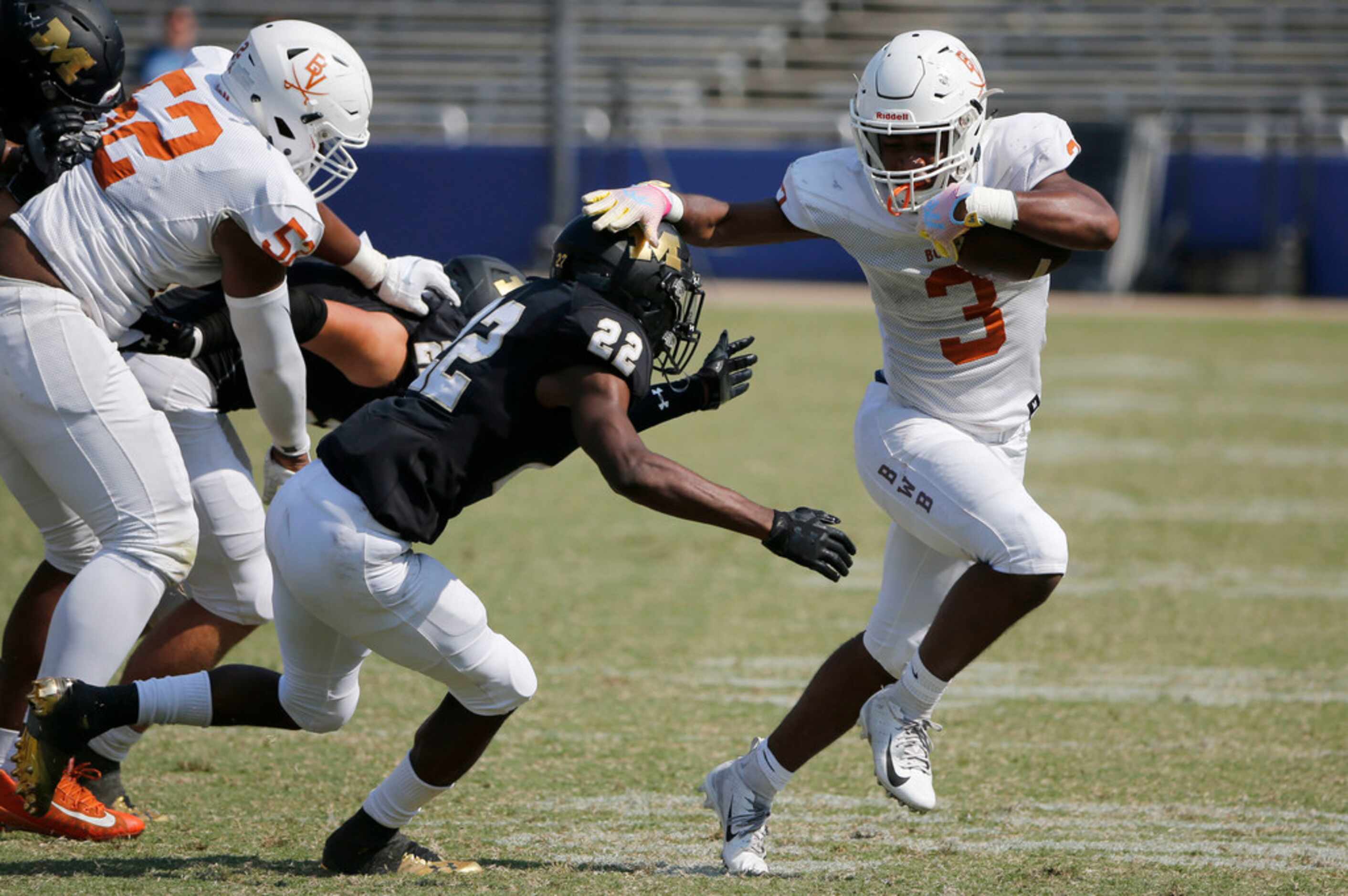 Arlington Bowie's D'Aunte Prevost breaks away from a tackle by Mansfield's Quentin Barclay...