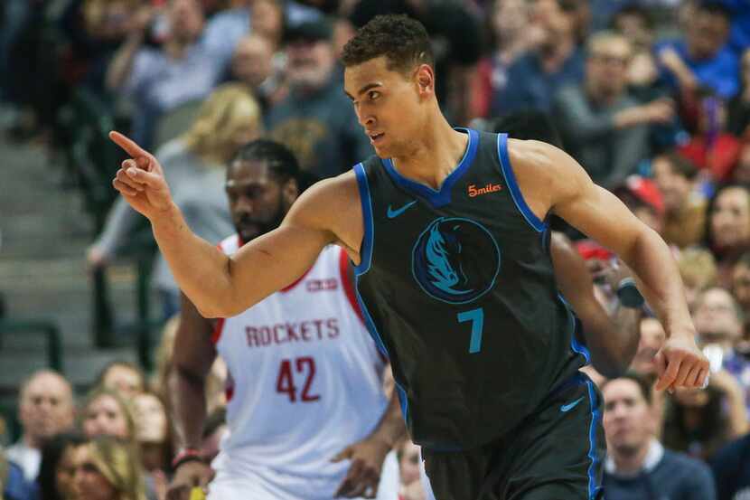 Dallas Mavericks forward Dwight Powell (7) celebrates a play during the second half a...