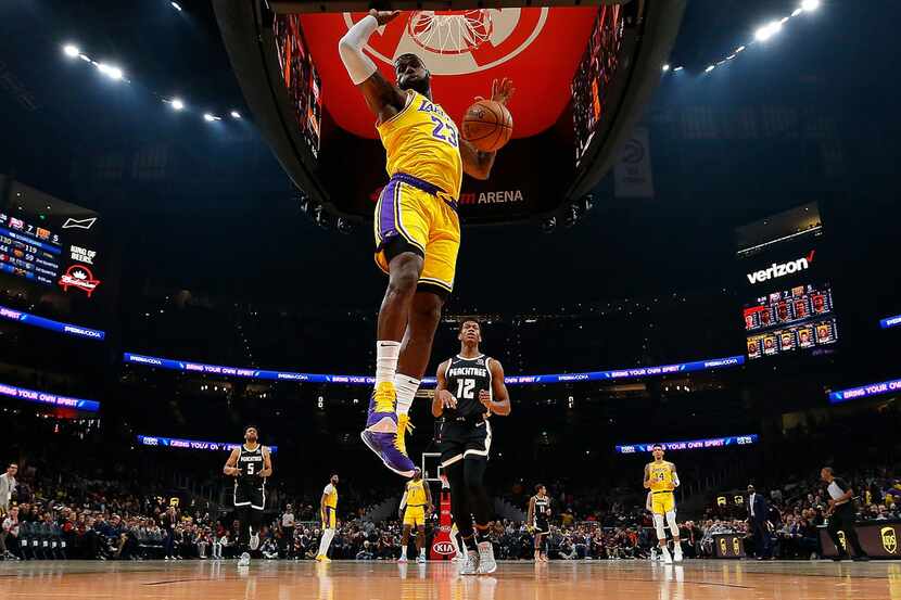 ATLANTA, GEORGIA - DECEMBER 15:  LeBron James #23 of the Los Angeles Lakers dunks against...