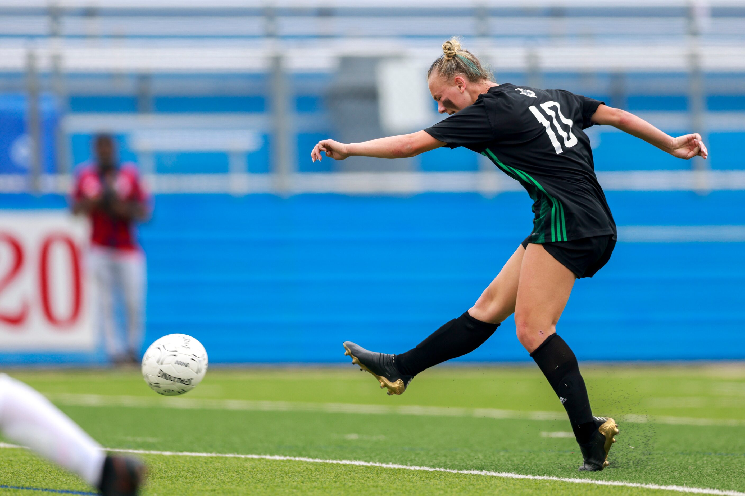 Southlake Carroll midfielder Kennedy Fuller (10) takes a shot on goal during the second half...