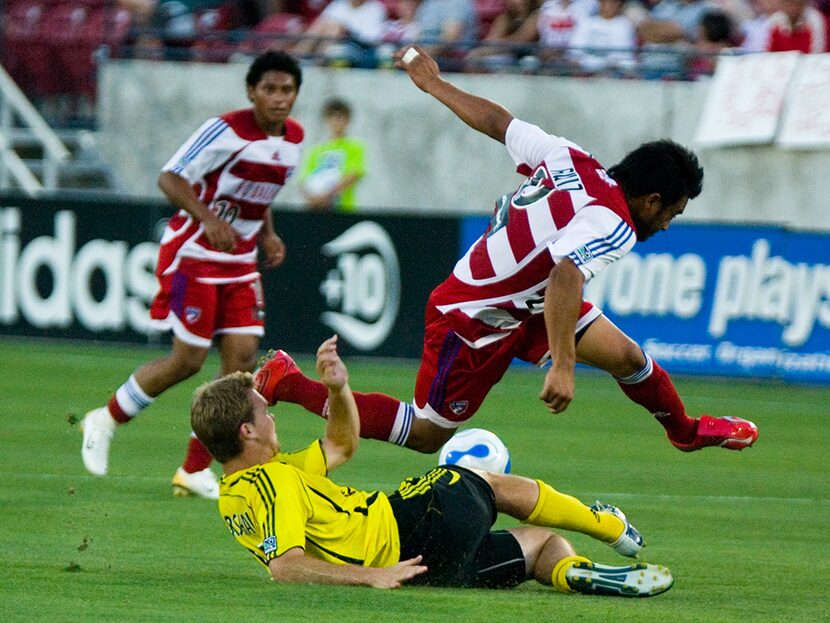 #20 Carlos Ruiz takes on the Columbus Crew at Pizza Hut Park in 2006.  Ramon Nunez #10 of FC...