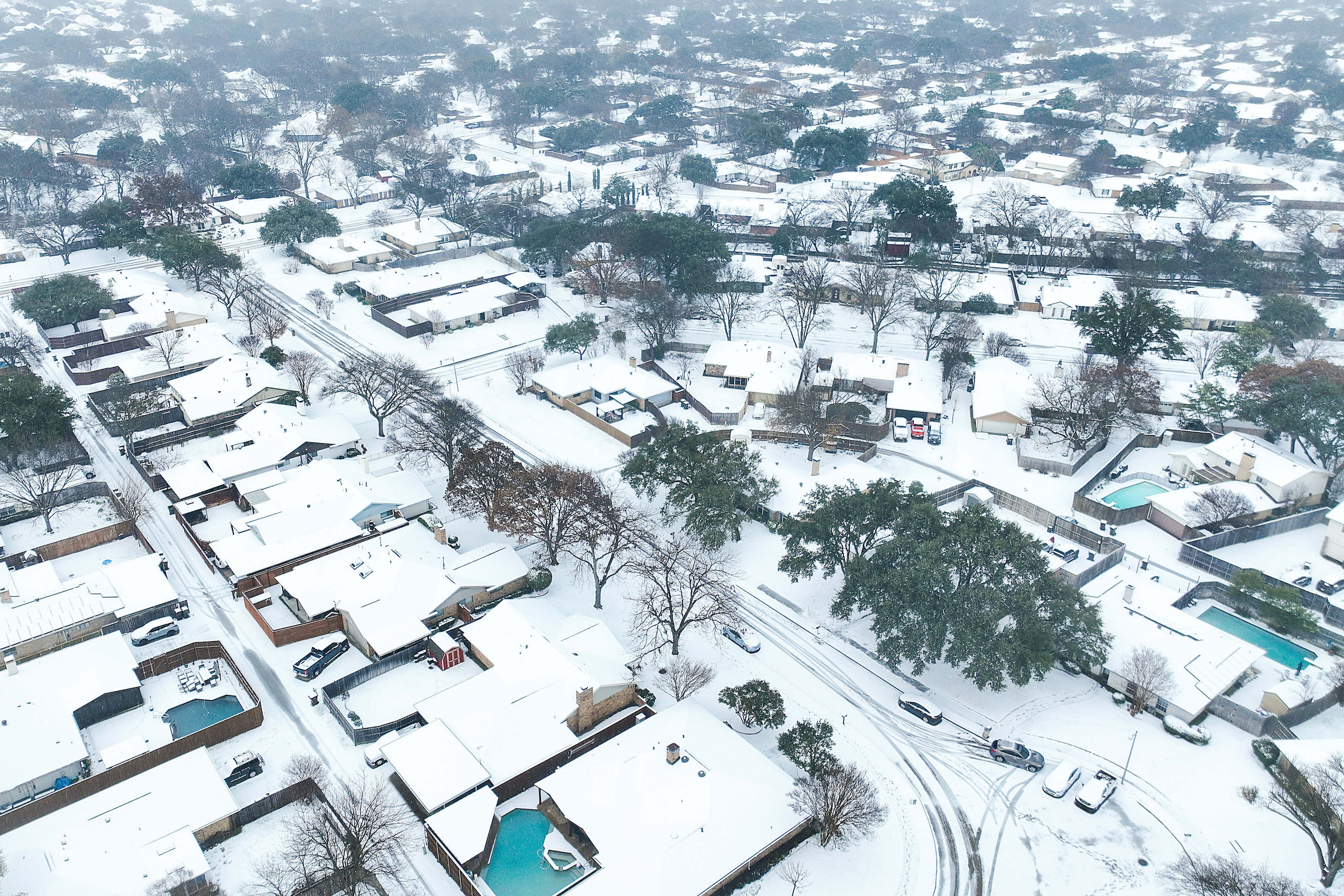 A neighborhood is covered in snow on Thursday, Jan. 9, 2025, in Plano.  A winter storm is...