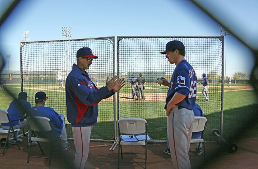  Texas pitching coach Mike Maddux, left, talks with pitcher Tanner Scheppers after his one...