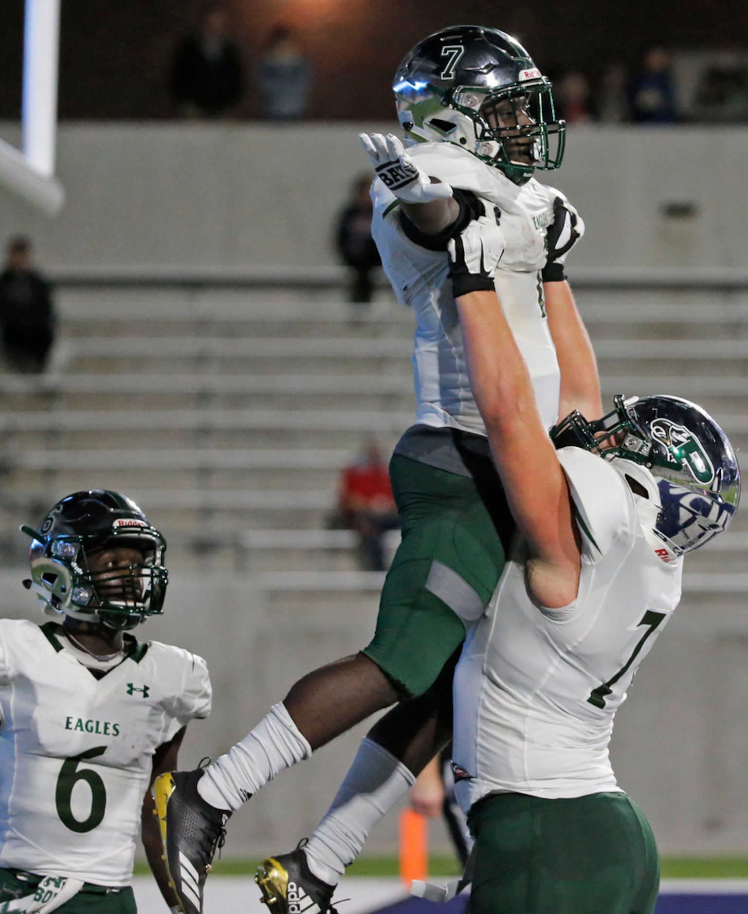 Prosper running back Wayne Anderson (7) is hoisted high by a teammate after a third-quarter...