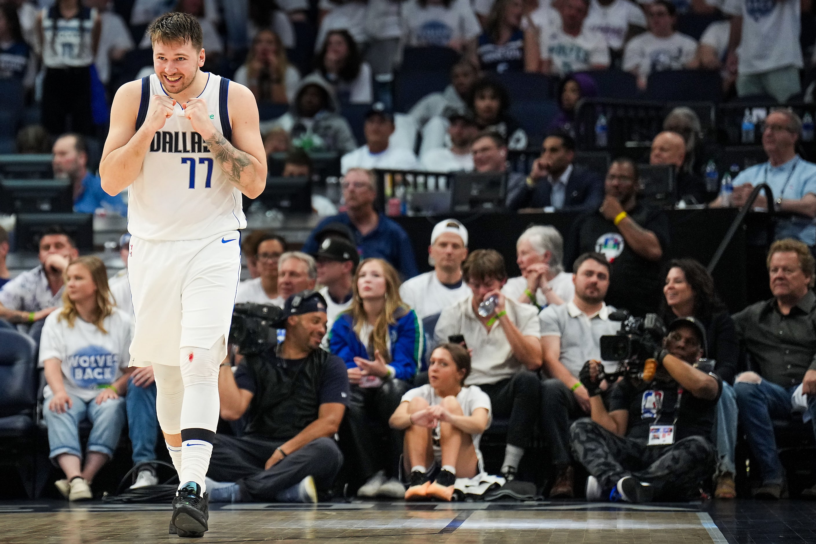 Dallas Mavericks guard Luka Doncic celebrates in the final minutes of a victory over the...