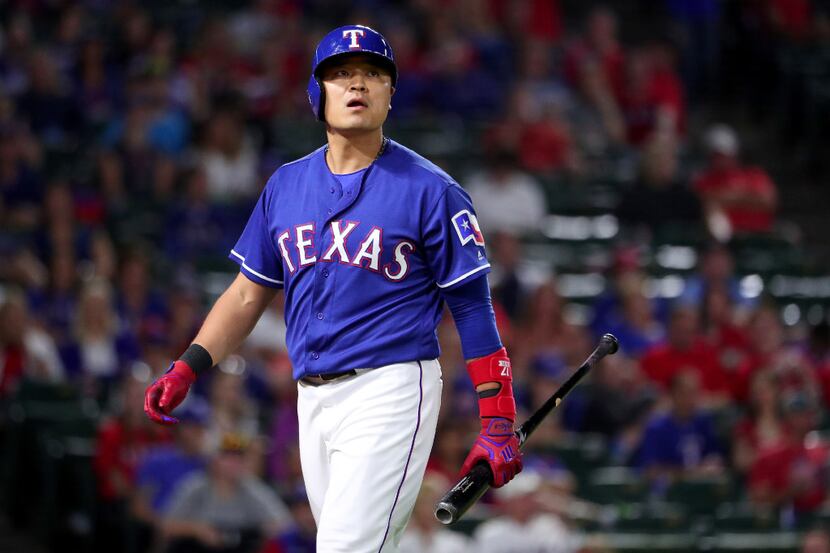 ARLINGTON, TX - OCTOBER 01:  Shin-Soo Choo #17 of the Texas Rangers reacts after striking...