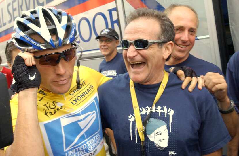 Overall leader Lance Armstrong, of Austin, Texas, left, jokes with visiting friend, US actor...