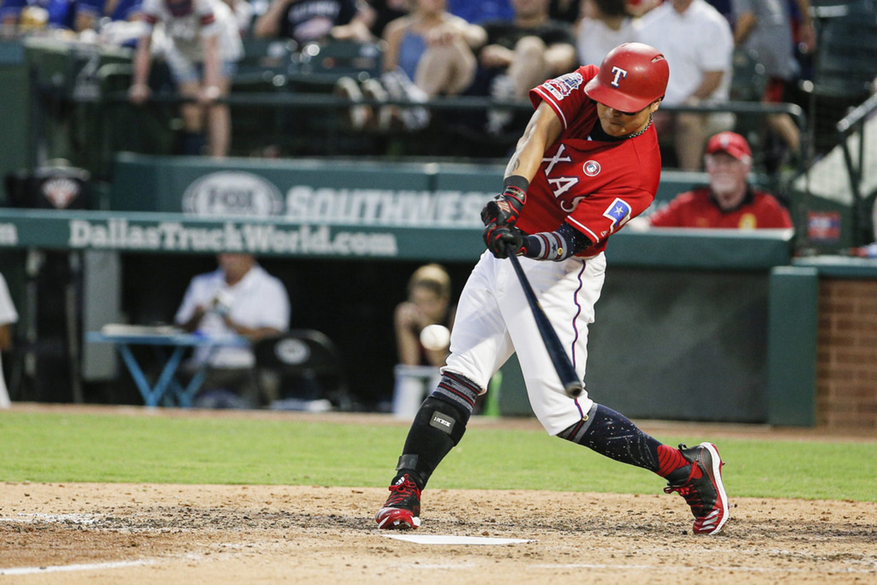 ARLINGTON, TX - JULY 4: Shin-Soo Choo #17 of the Texas Rangers makes contact for a double...