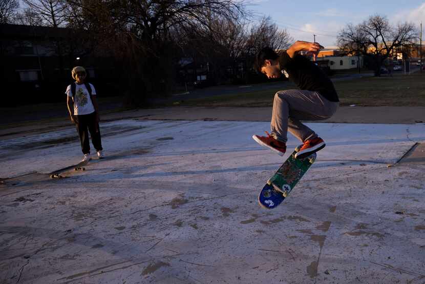 Aaron Vargas, 14, attempts a trick as Gavin Peoples, 16,  watches on Friday, Jan. 6, 2023,...