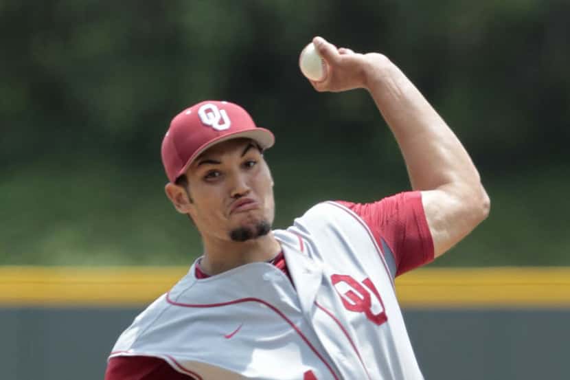 Starting pitcher Adam Choplick of the University of Oklahoma throws against TCU on Sunday...