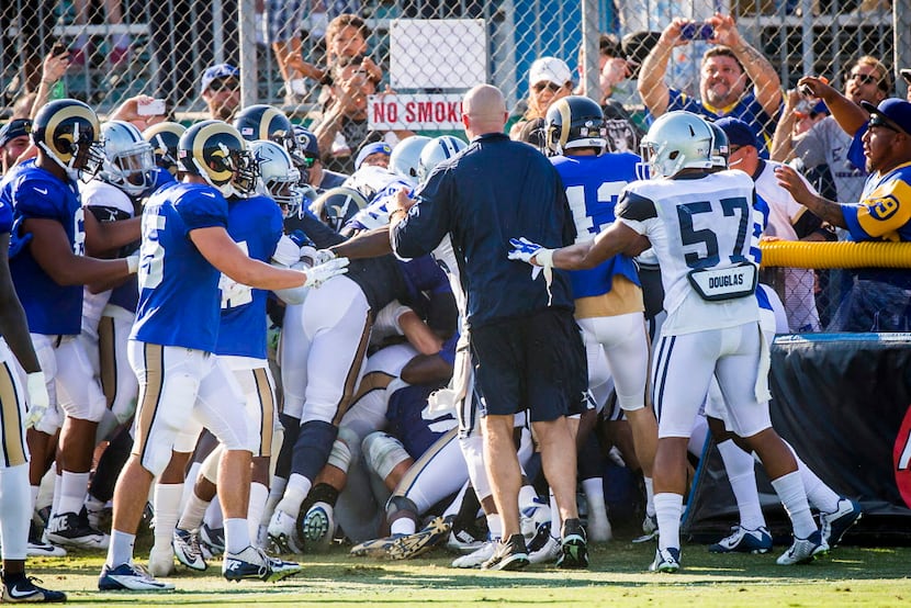 Dallas Cowboys and St. Louis Rams players fight during a joint practice at Cowboys training...