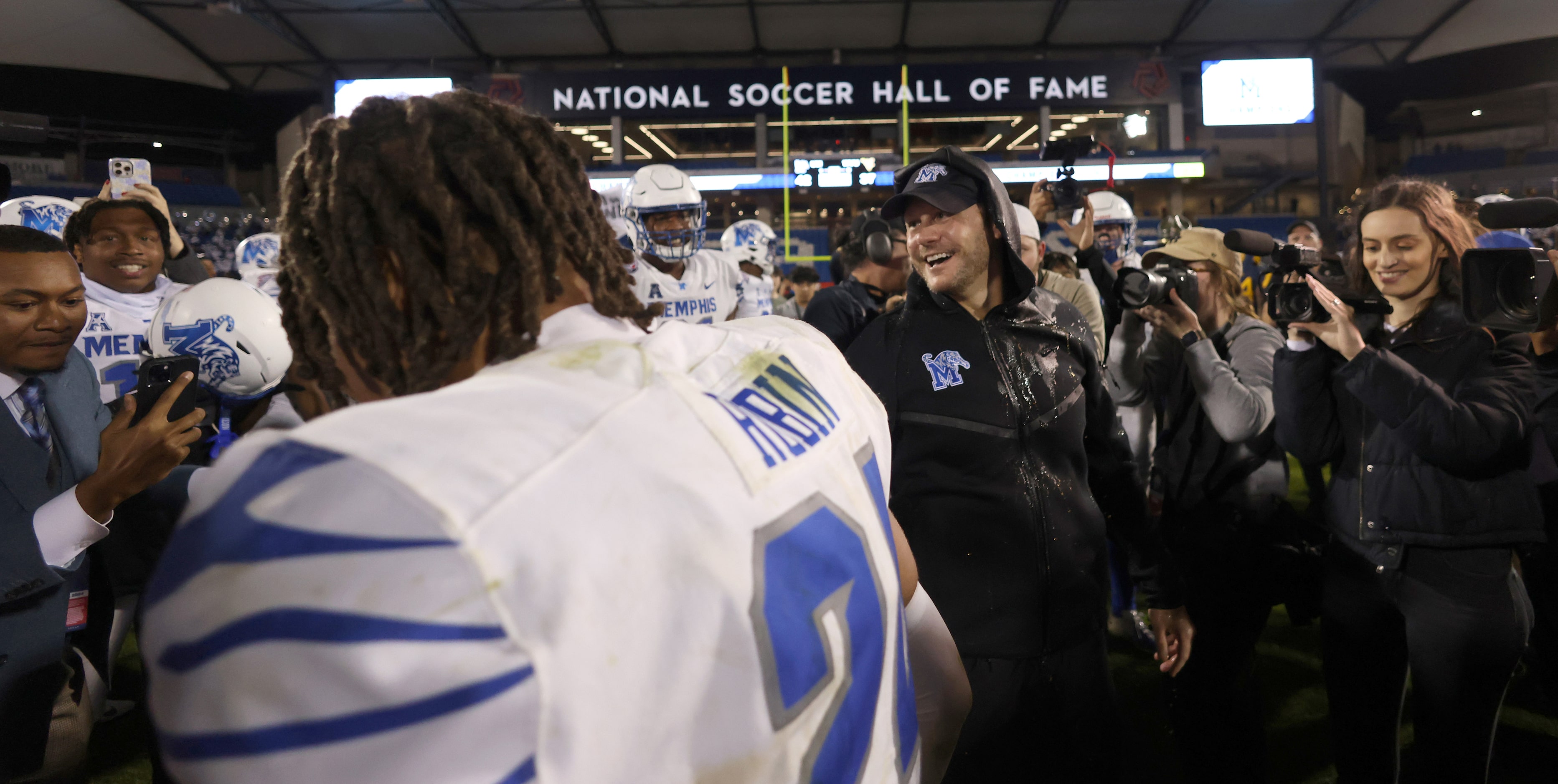 Memphis head coach Ryan Silverfield, center right, was all smiles after being doused with a...