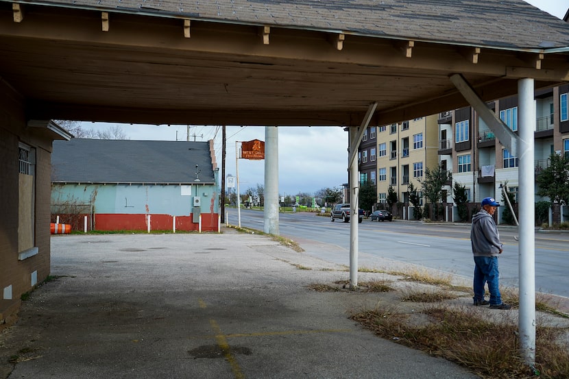 On Thursday, a man waits for a bus in front of the Star service station once owned by the...