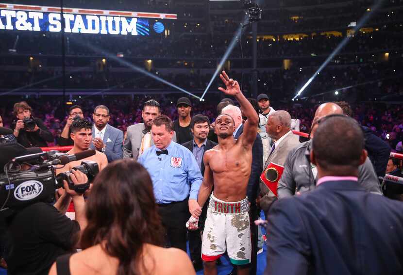 Errol Spence Jr. waves as fans chant right before he was declared winner of an IBF World...