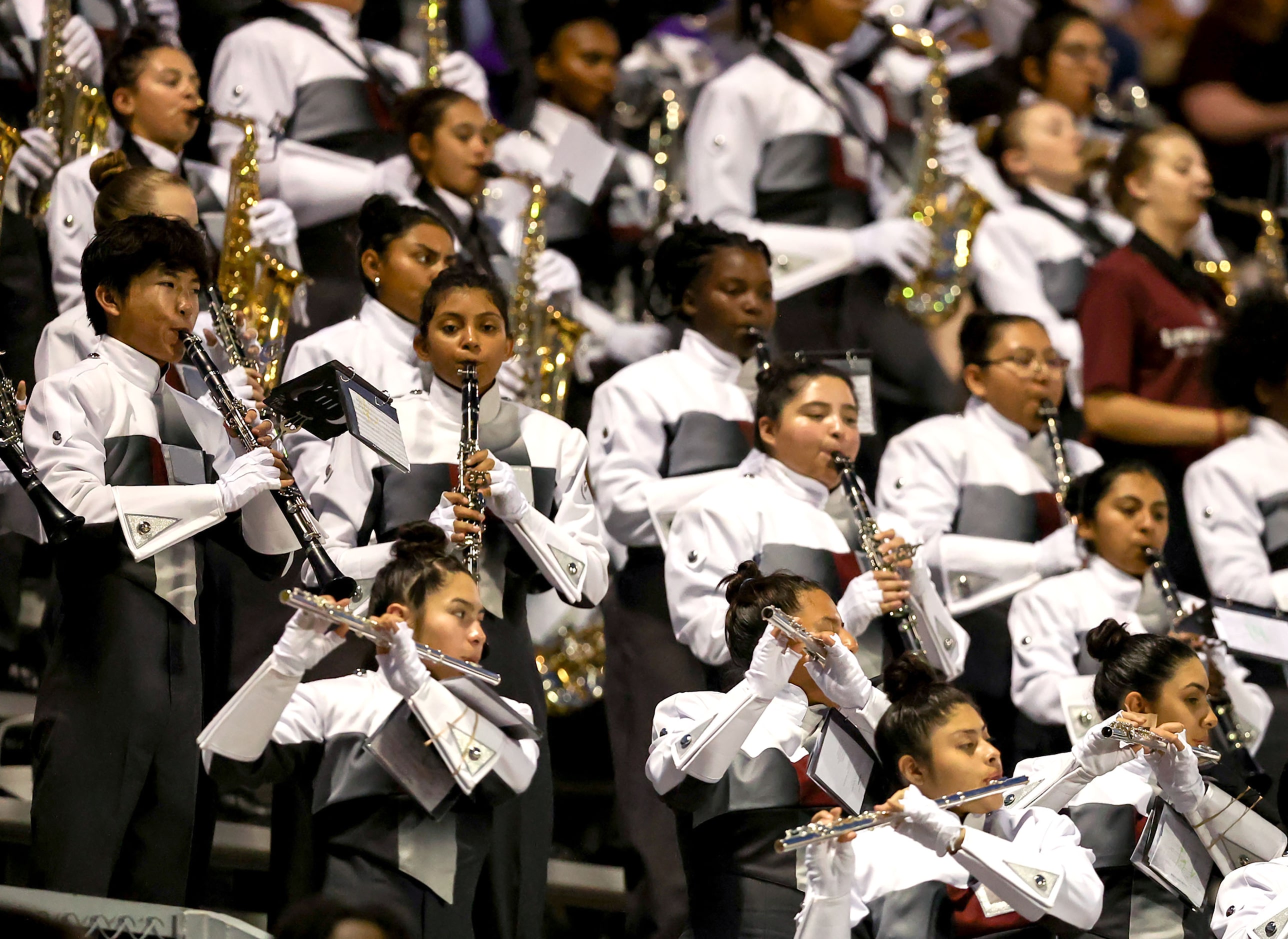 The Lewisville Fighting Farmers band performs during the game against Denton Braswell in a...