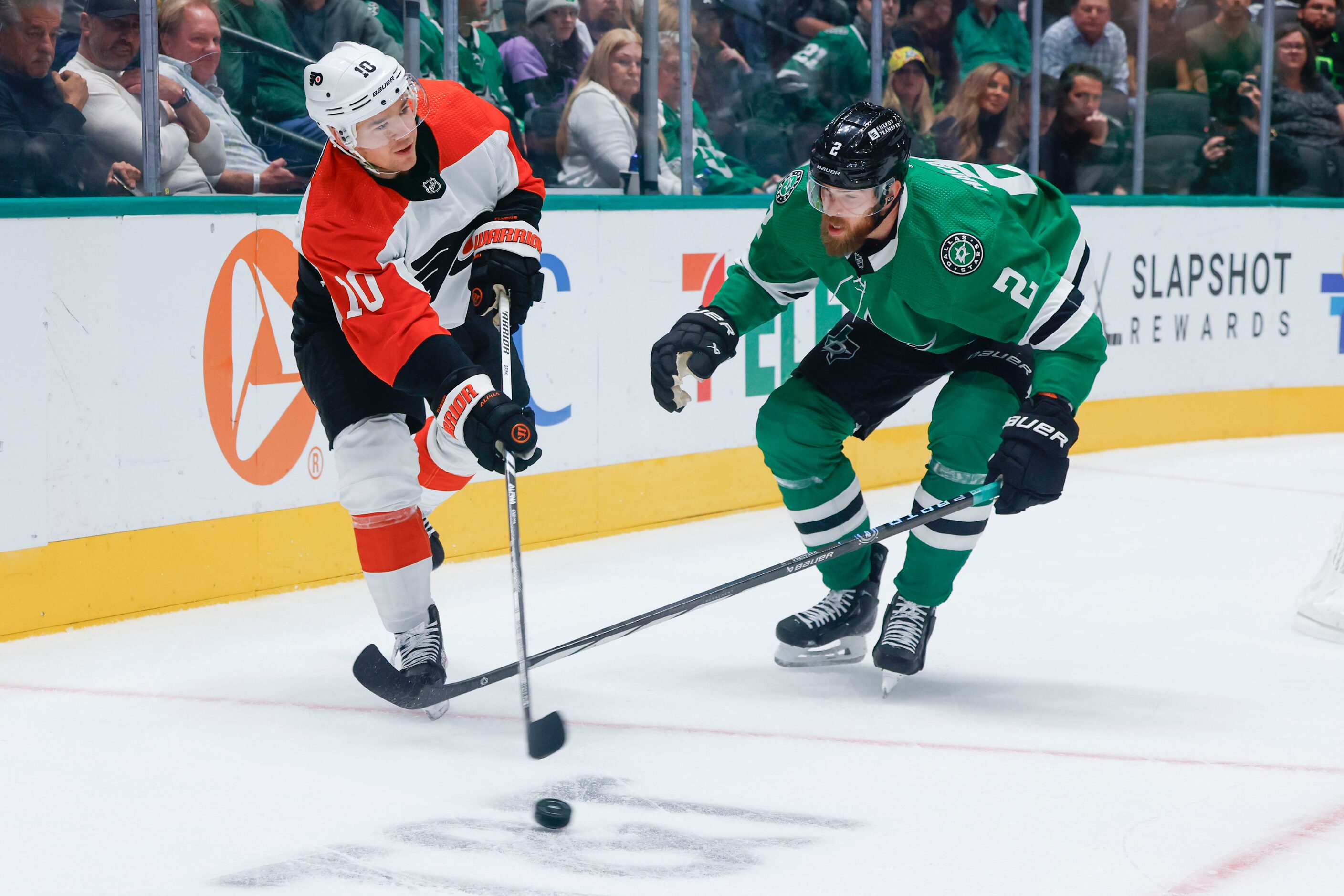 Philadelphia Flyers right wing Bobby Brink (left) handles the puck against Dallas Stars...