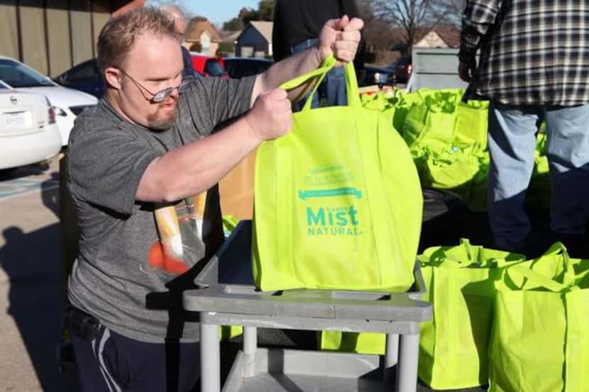 
Keith Tackett helps unload the bags at the Portable Pantry drop off day in December.
