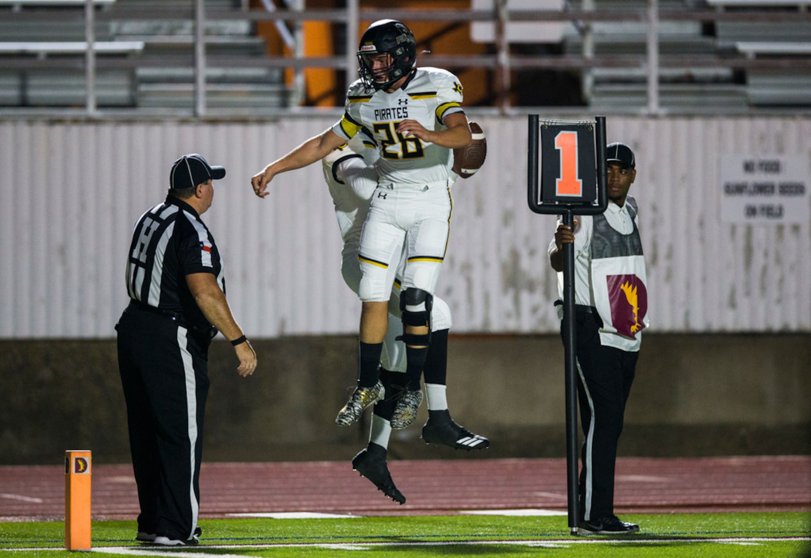 Crandall's Sammy Omosigho (7) and Noah Barnhill (26) celebrate after scoring a two-point...