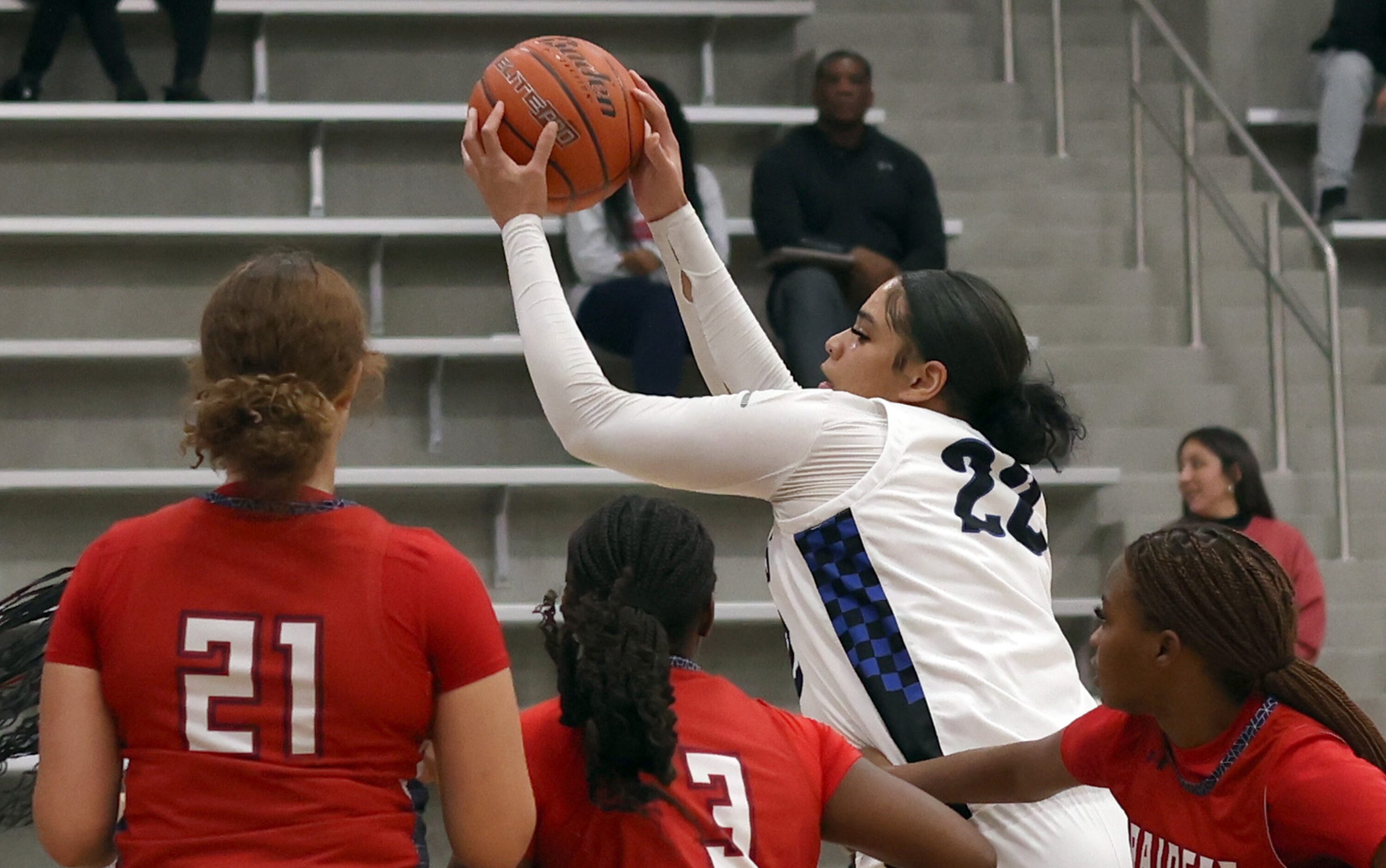 Hebron center Jordan Thomas (22) pulls down an offensive rebound as a trio of Denton Ryan...