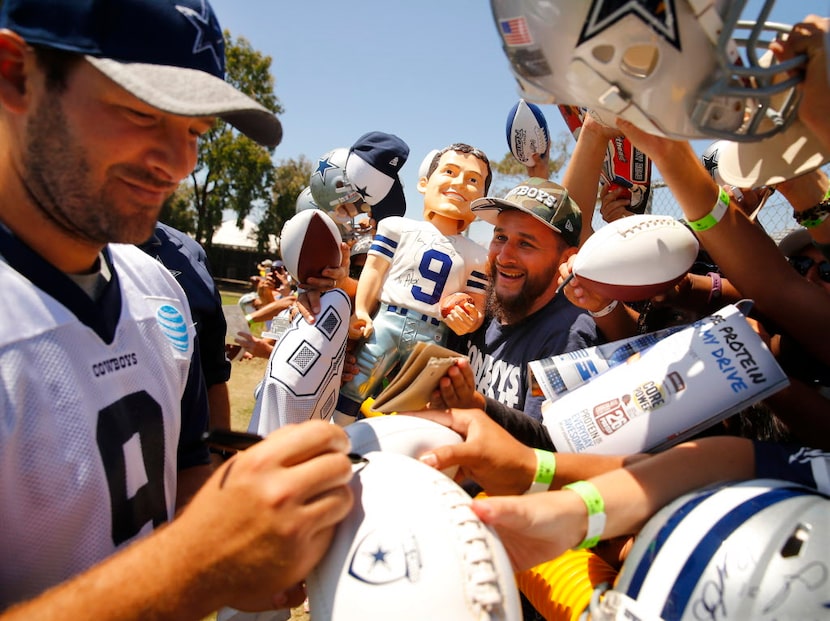 Dallas Cowboys fan Alex Hurtado of San Diego (center) is tickled with joy after Dallas...