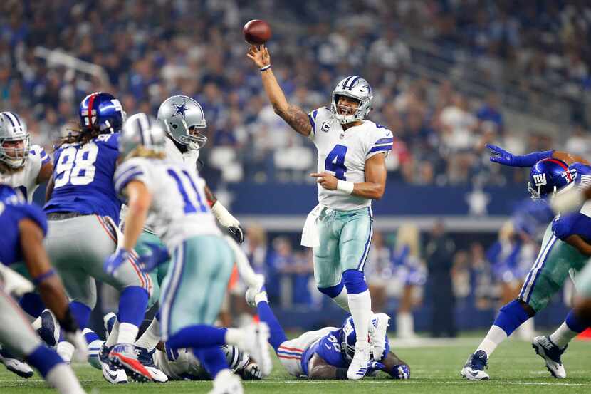 Dallas Cowboys quarterback Dak Prescott (4) throws a first half pass to wide receiver Cole...
