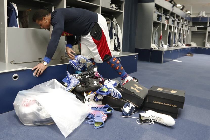 Defensive end Greg Hardy, who becomes a free agent this offseason, cleans out his locker at...