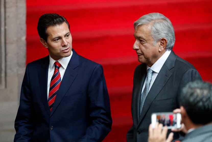 Mexican President Enrique Pena Nieto (left) and President-elect Andres Manuel Lopez Obrador...