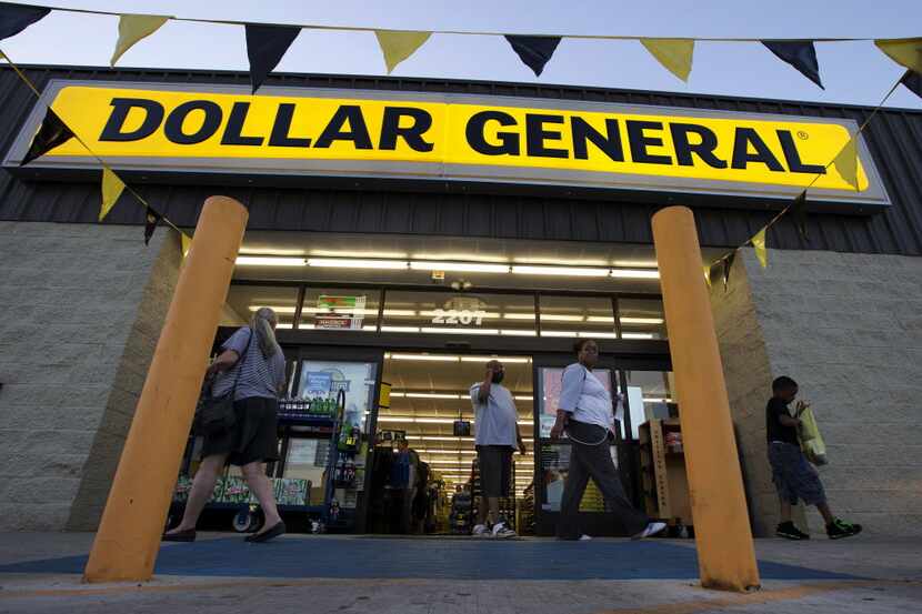 FILE -In this Wednesday, Sept. 25,  file 2013, photo, customers exit a Dollar General store,...