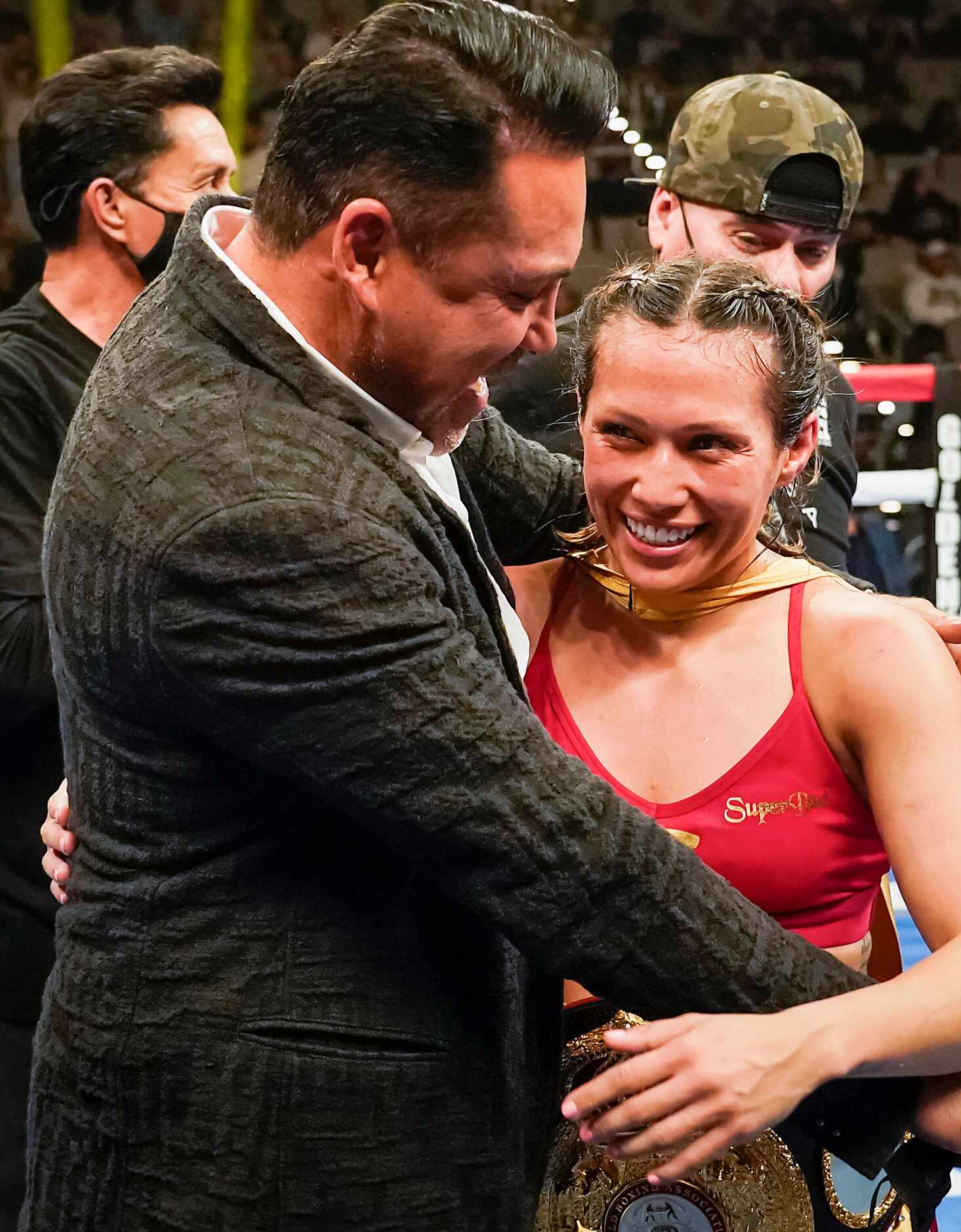 Seniesa Estrada gets a hug from Oscar De La Hoya after defeating Anabel Ortiz for the WBA...