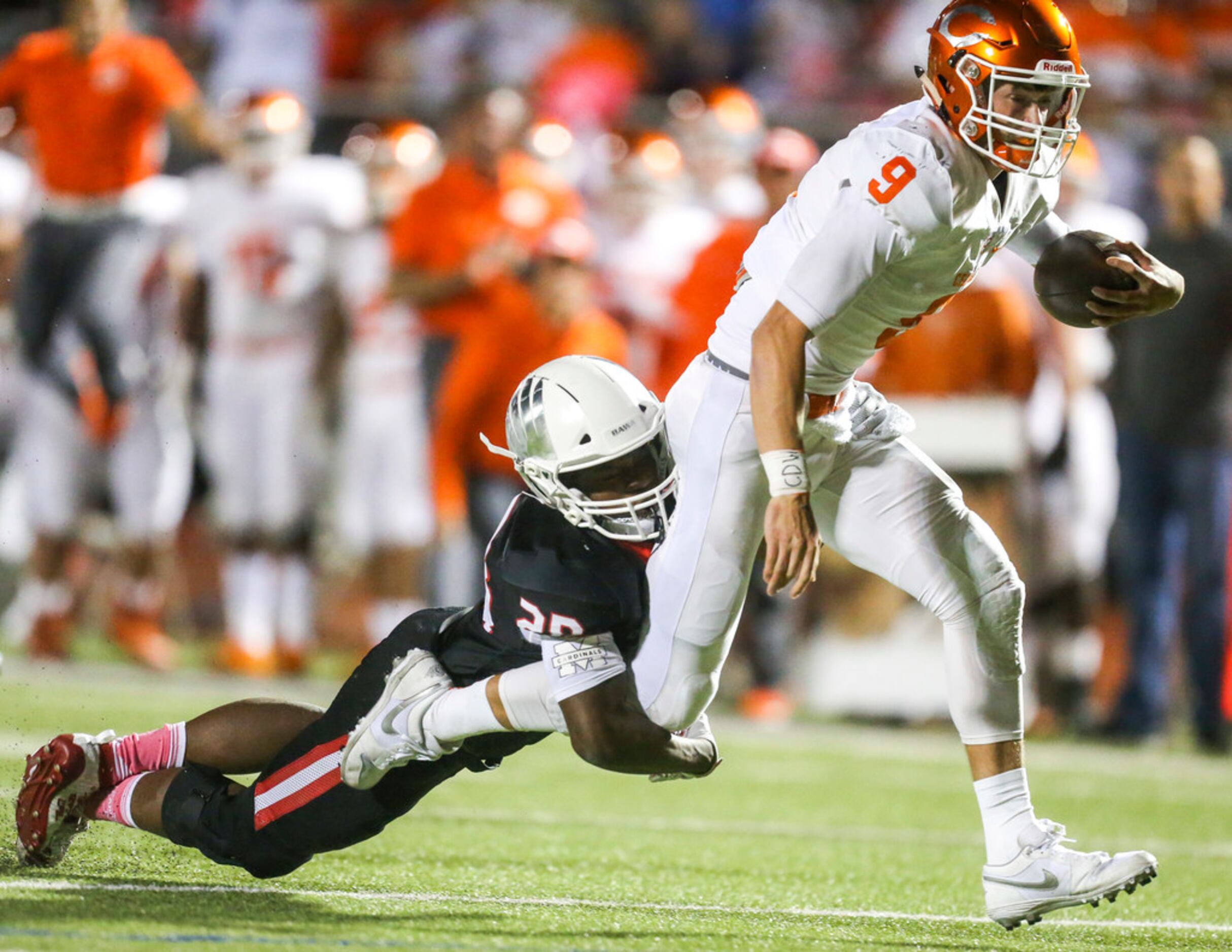 Celina quarterback Hunter Watson (9) carries the ball past Melissa linebacker Braylon Brown...