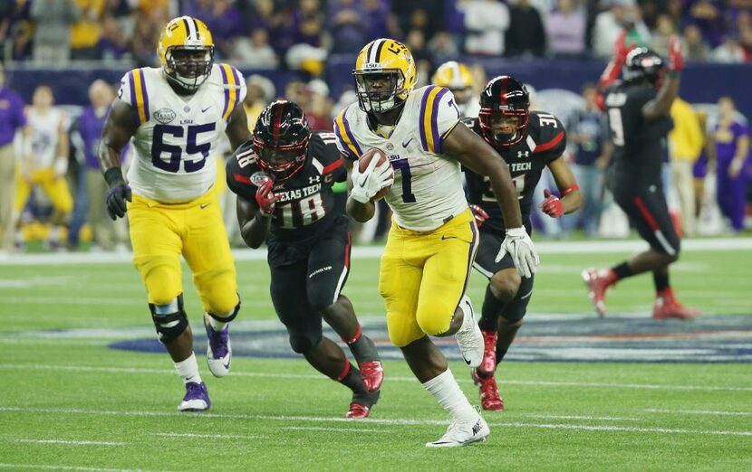 HOUSTON, TX - DECEMBER 29:  Leonard Fournette #7 of the LSU Tigers runs for a 43-yard...