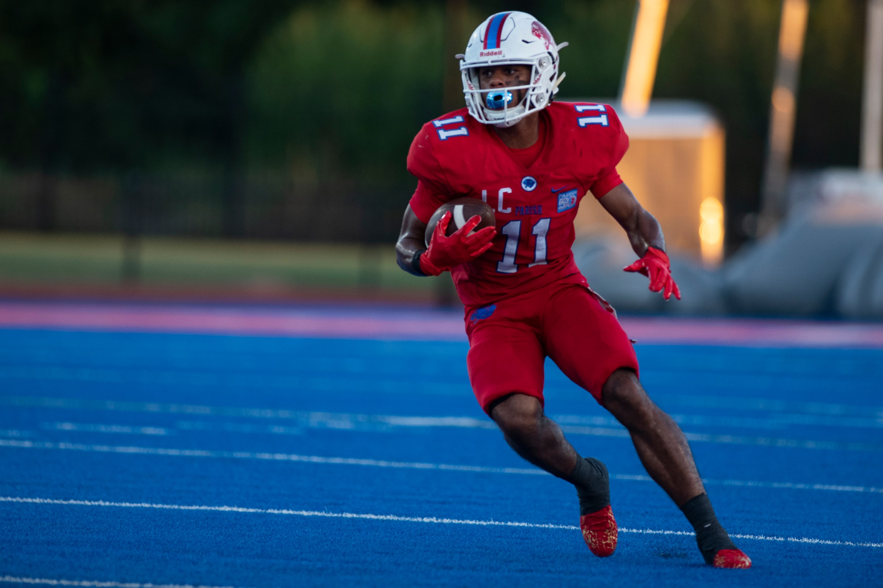 Parish Episcopal senior Noah Billings (11) looks down the field after catching a pass during...