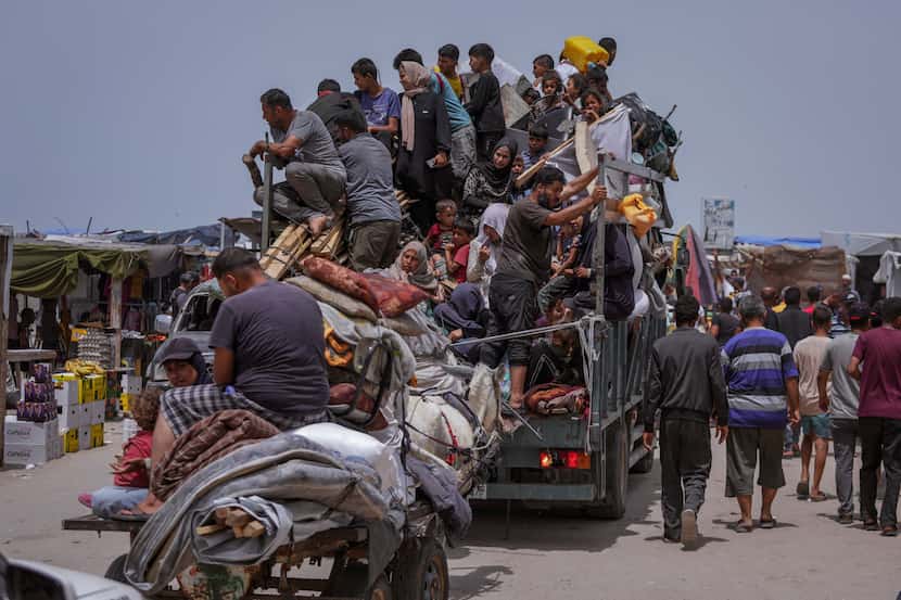 FILE - Palestinians fleeing from the southern Gaza city of Rafah during an Israeli ground...