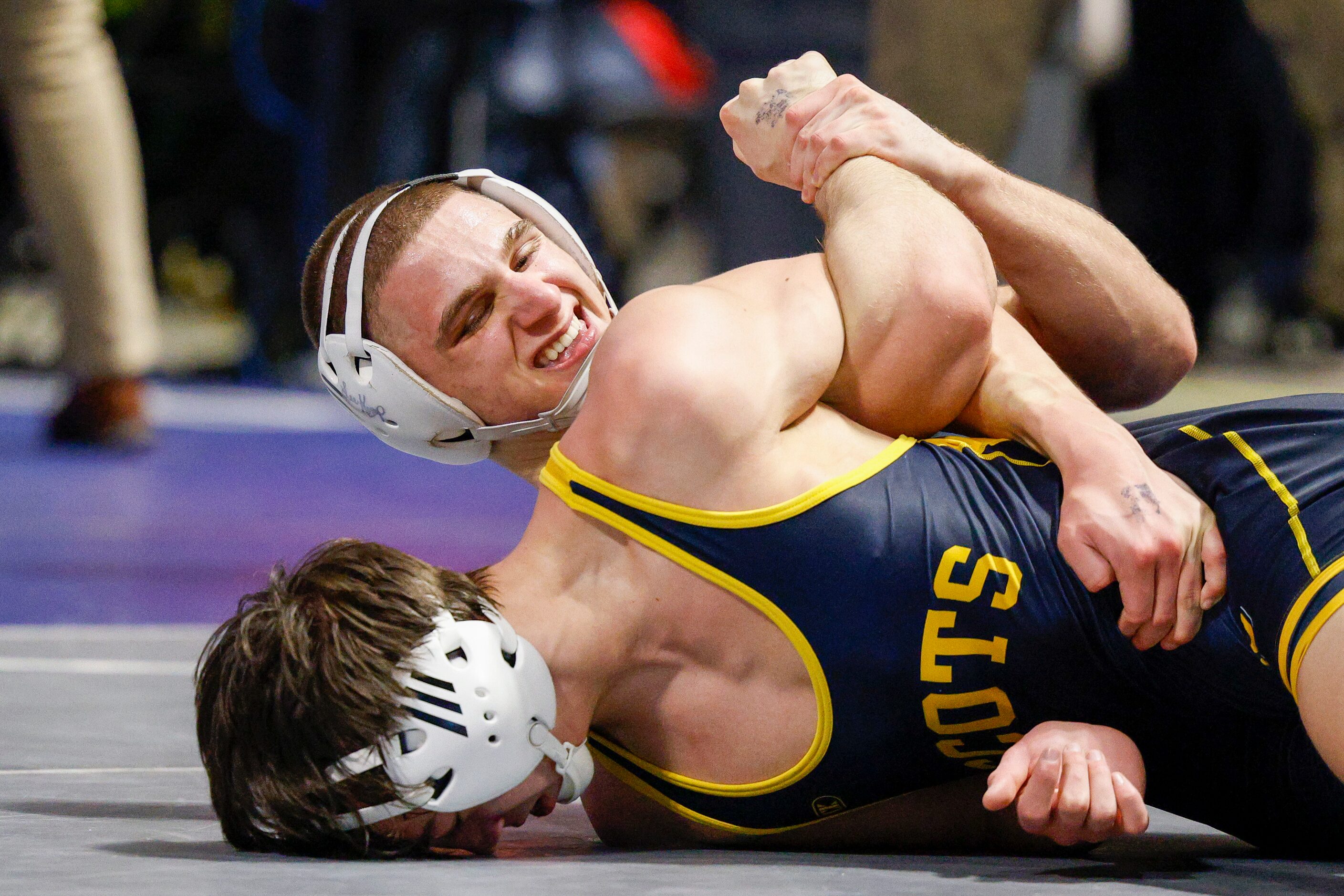 David Ray of Highland Park (left) wrestles Jasin Sejdini of Frisco Centennial during a...