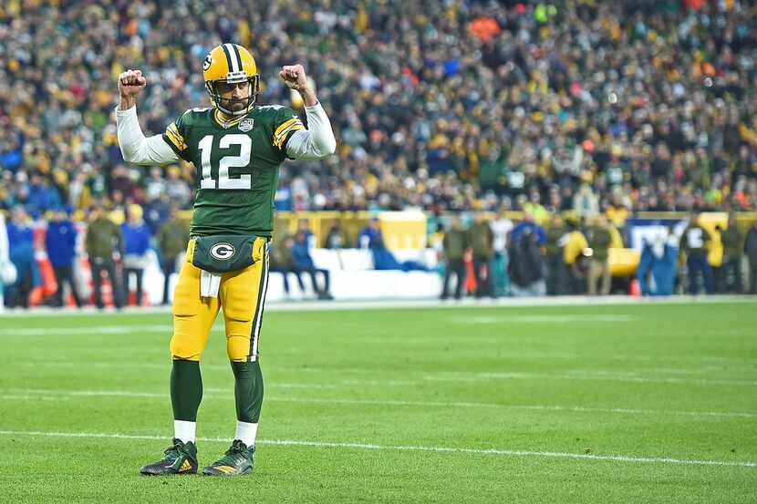 GREEN BAY, WI - NOVEMBER 11:  Aaron Rodgers #12 of the Green Bay Packers celebrates a...