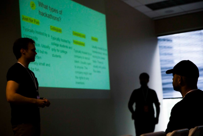 Austin Wells (left), executive director at HackDFW, and Adil Shaikh (center), founder and...