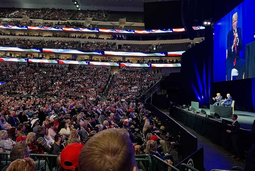 Former President Donald Trump appears Sunday before the crowd at American Airlines Center in...