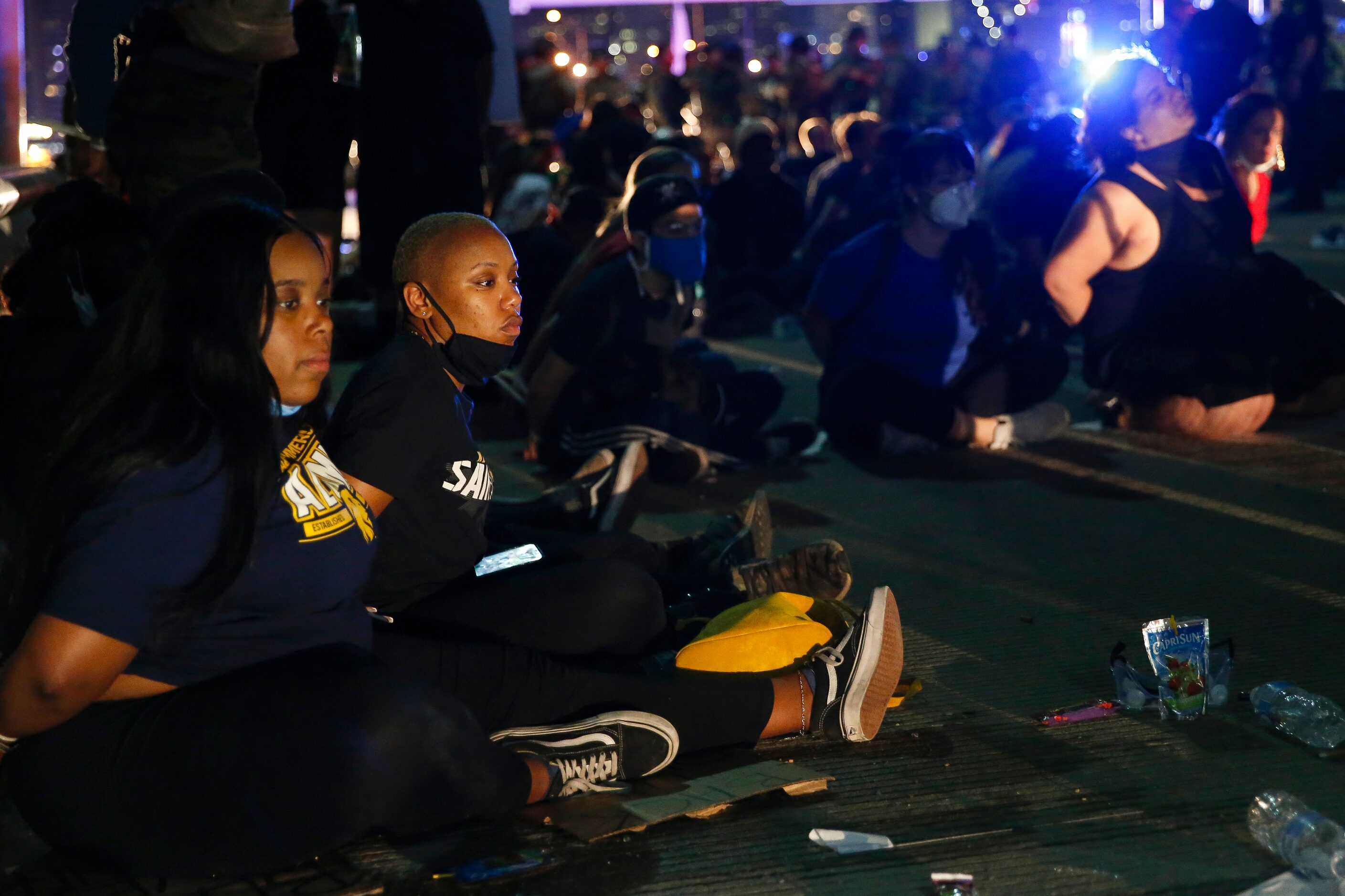 Police surround and detain hundreds of protesters who marched onto the Margaret Hunt Hill...