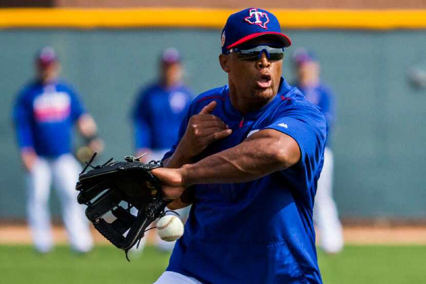 Texas Rangers third baseman Adrian Beltre (29) catches  ball in the infield during batting...
