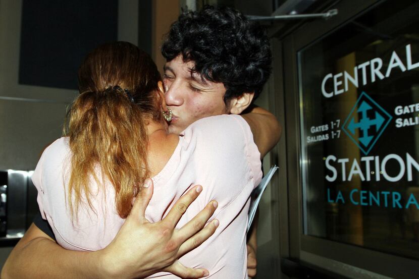 Francisco Galicia (right) kisses his mother Sanjuana Galicia at the McAllen Central Station....