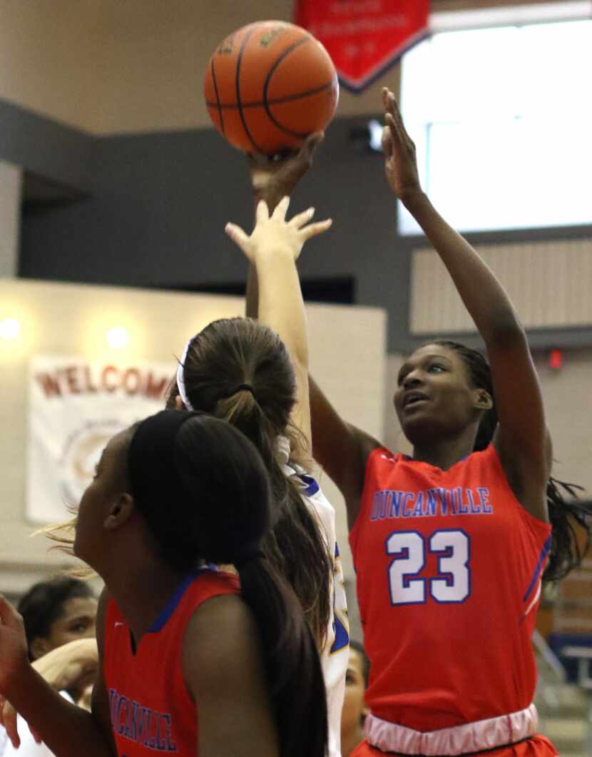 Duncanville forward Starr Jacobs (23) puts up a shot during first half action against...