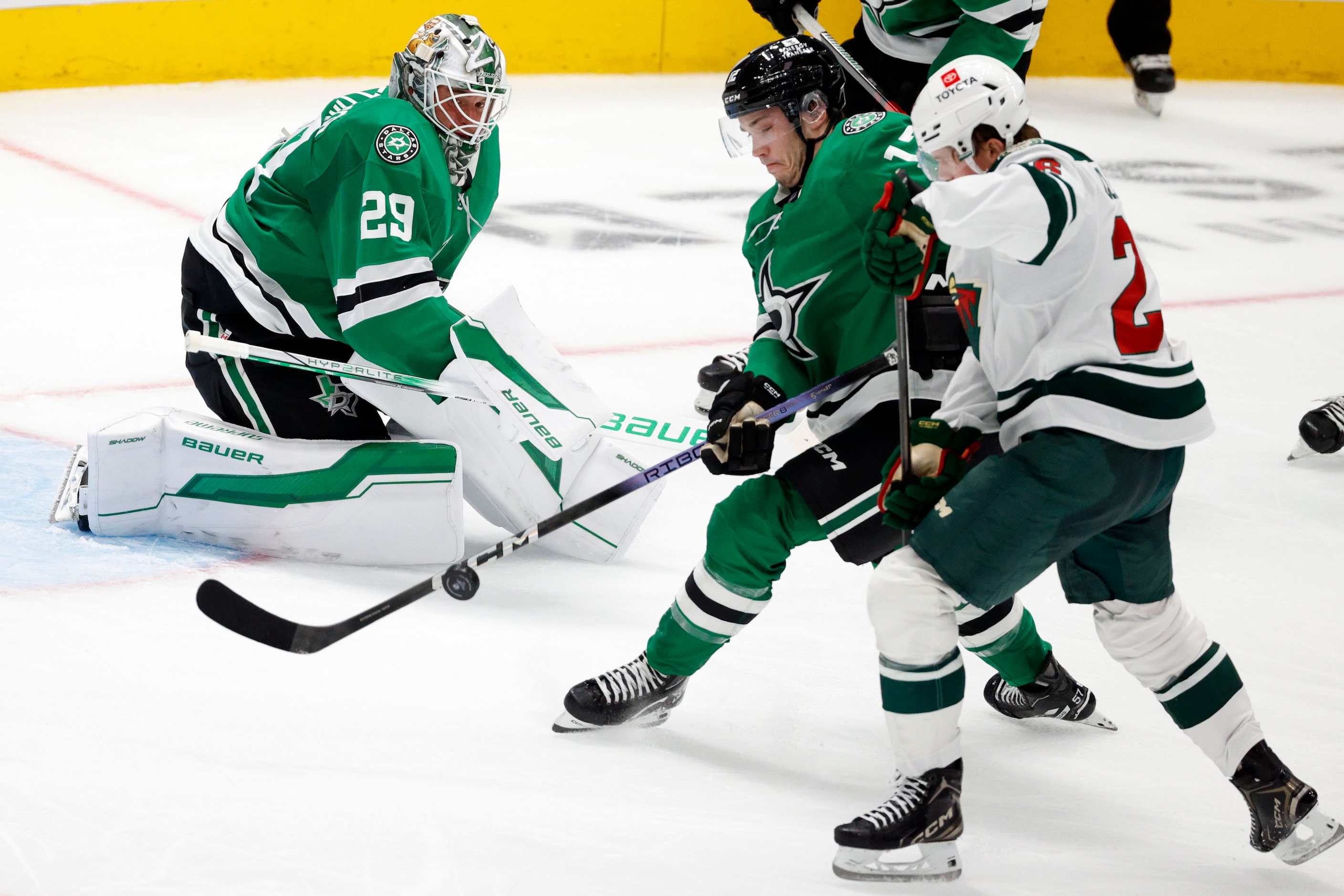 Dallas Stars right wing Arttu Hyry (12) and Minnesota Wild right wing Graeme Clarke (26)...