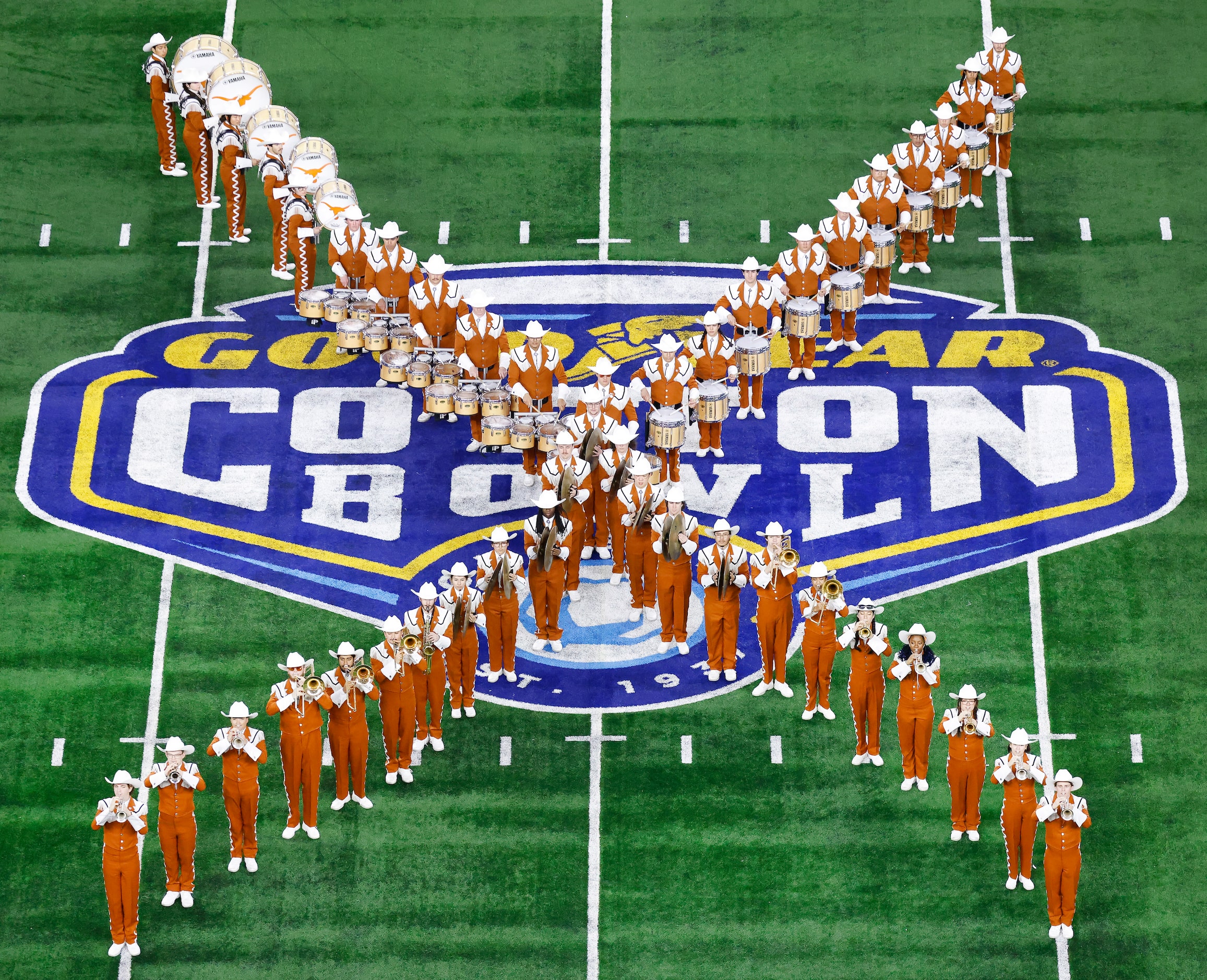 The University of Texas Longhorn Band form the lefter X in Texas during their pregame...