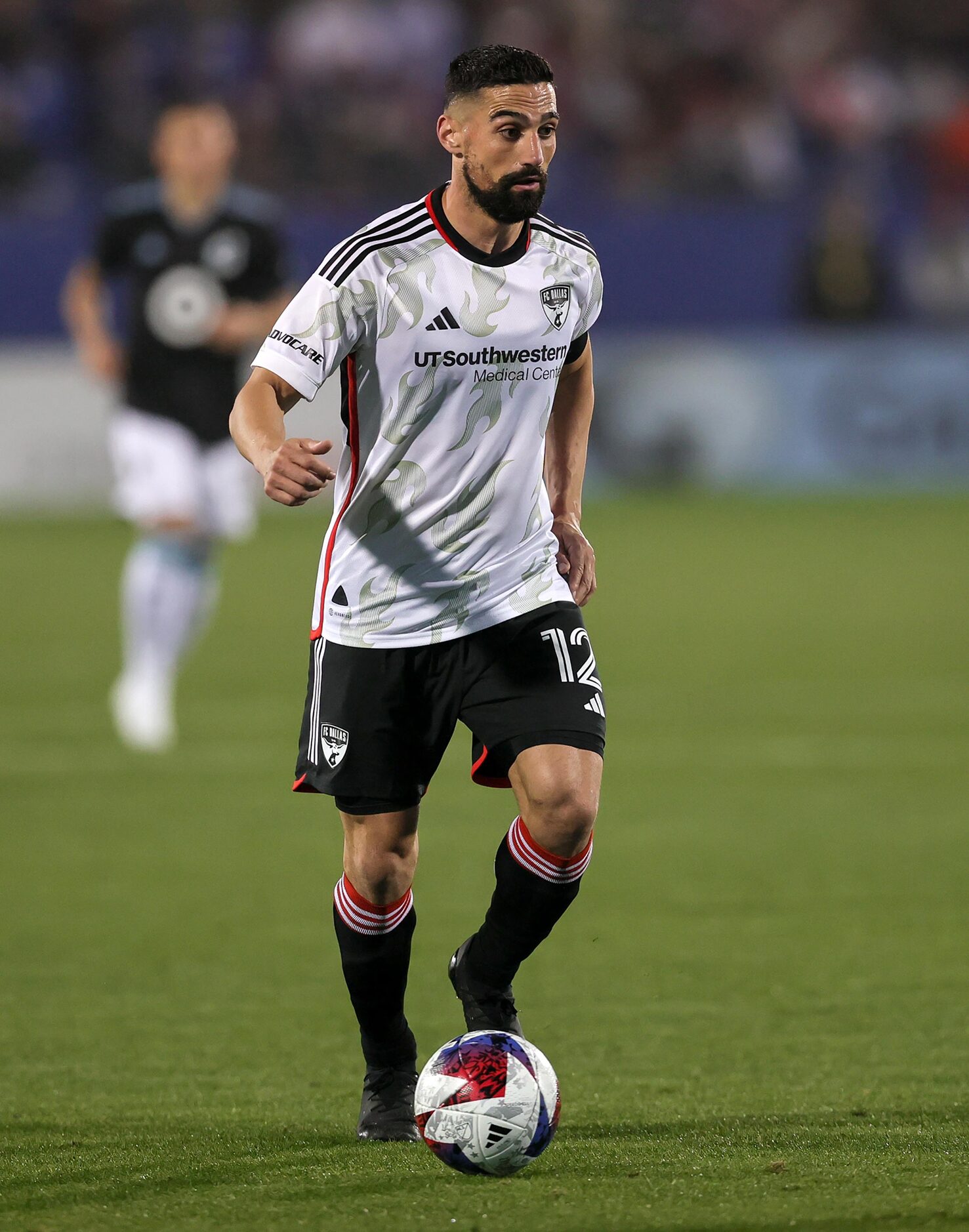 FC Dallas midfielder Sebastian Lletget dribbles the ball down field against Minnesota United...