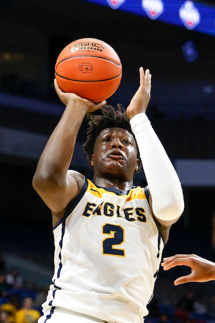 Oak Cliff Faith Family Academy forward Brandon Walker (2) shoots the ball during the second...