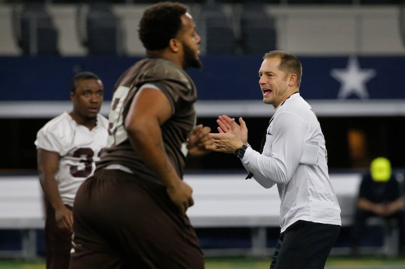 Western Michigan head coach PJ Fleck encourages his troops during practice for the Goodyear...