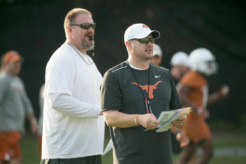 Texas Strength and Conditioning coach Yancy McKnight oversees practice with head coach Tom...