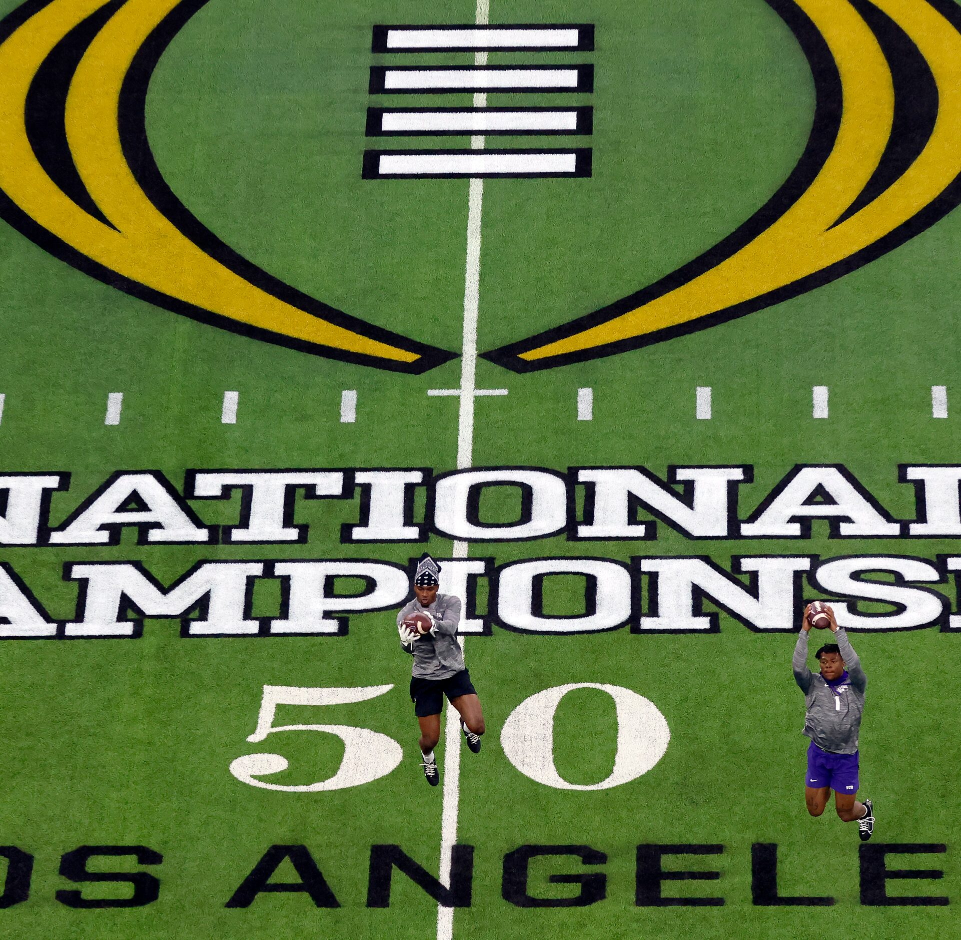 The TCU Horned Frogs football players warm up before facing the Georgia Bulldogs for the CFP...