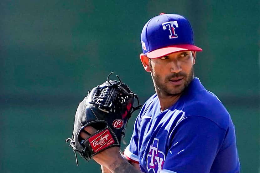 Texas Rangers pitcher Matt Bush throws live batting practice uring a spring training workout...